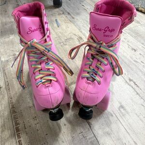 Sure-Grip Pink Roller Skates with Rainbow Laces